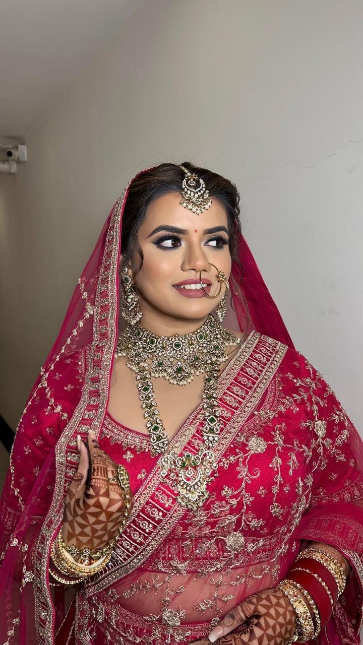 Elegant HD bridal makeup look with defined natural features and classic updo by Ritika Verma MUA